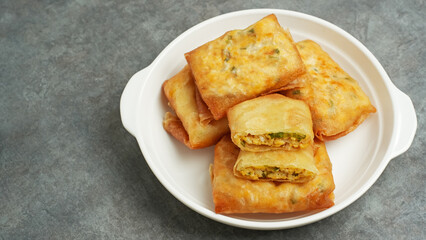 Martabak Tahu or Tofu Spring Rolls, filled with tofu, leek and egg. Indonesian food
