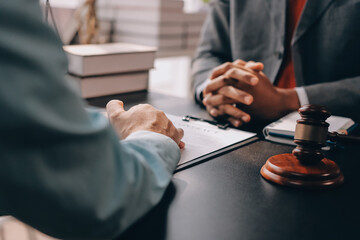 Lawyer explained to the client about the law that must be brought against the court case.