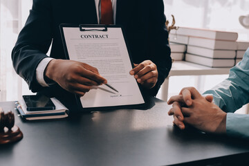 Lawyer explained to the client about the law that must be brought against the court case.