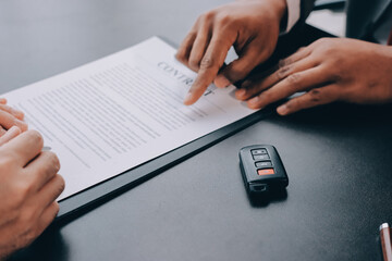 Car salesman gave the keys to the customers who signed the purchase contract legally, Successful...