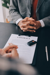Car salesman gave the keys to the customers who signed the purchase contract legally, Successful...