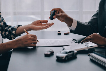 Car salesman gave the keys to the customers who signed the purchase contract legally, Successful...