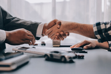 Car salesman gave the keys to the customers who signed the purchase contract legally, Successful...