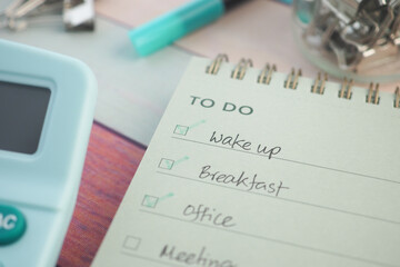 Grocery list and to-do tasks on a workspace notepad