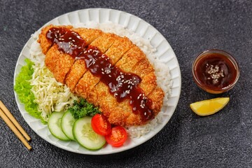 Chicken katsu or tori katsu is a Japanese dish consisting of seasoned chicken breast pieces, breaded and fried until crispy.