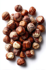 Fototapeta premium Piedmont hazelnuts scattered on white