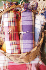 Textiles displayed in a woven basket at a market