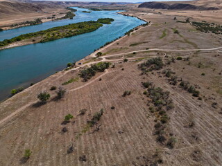 The Ili River and the sandy coastal area. The largest river in Semirechye. The view from the drone....