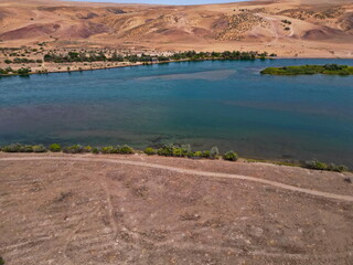 The Ili River and the sandy coastal area. The largest river in Semirechye. The view from the drone....