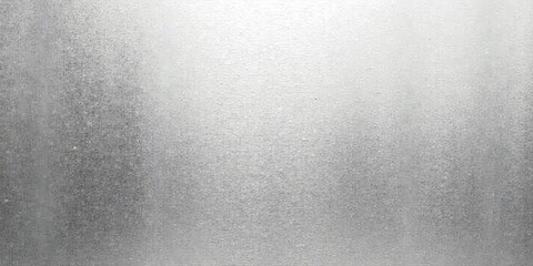 High-resolution image showcasing a subtly textured metallic surface with a gradient of grayscale tones, ideal for backgrounds and design projects.