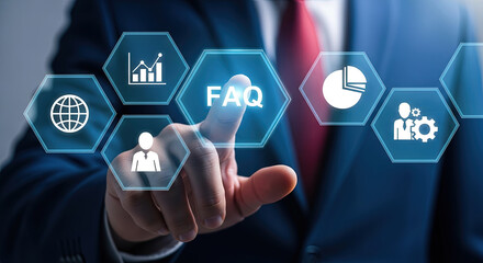 Businessman's finger touches the glowing FAQ icon amidst virtual business data icons on a screen
