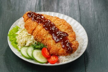 Ayam Teriyaki. Teriyaki chicken katsu is a Japanese dish consisting of pieces of chicken cooked in a sweet and savory teriyaki sauce. Teriyaki sauce is made from soy sauce, sugar, and spices.