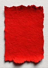 Red paper fragment on white