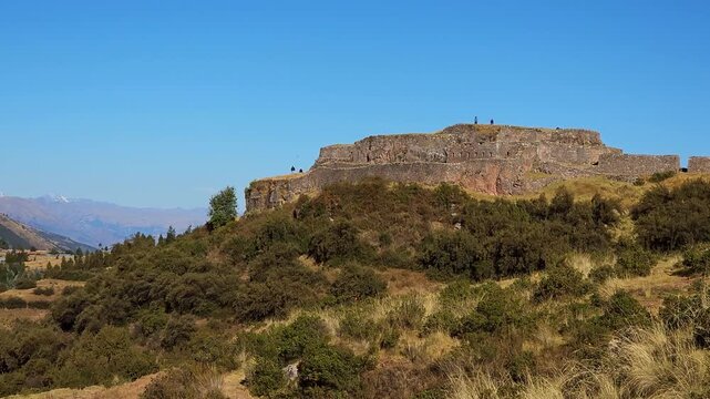 A breathtaking panoramic video capturing the ancient Inca military fortress of Puka Pukara. The expansive walls and terraced landscape against the stunning backdrop of the Andean mountains and valleys