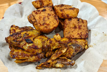 Grilled Chicken and Grilled Tofu with Soy Sauce Seasoning Served as Indonesian Inspired Cuisine