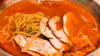 Korean Spicy Noodles with Sliced Chicken Served in Traditional Asian Bowl