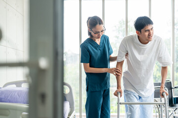 Obraz premium Physical therapy. Female Nurse aids young man in recovering from spine injury and providing orthopedic massage Orthopedic healthcare and chiropractor with person for physical therapy rehabilitation