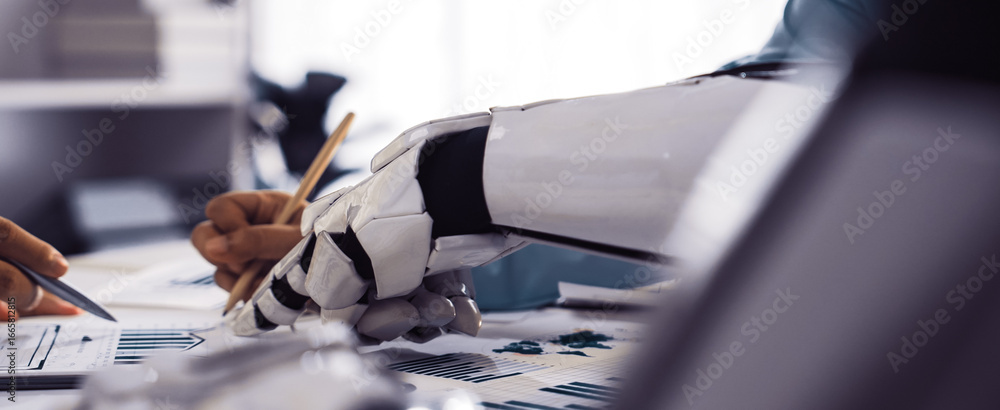 Poster human and robot collaboration in modern workplace with analytics on desk, focus on robotic arm and h