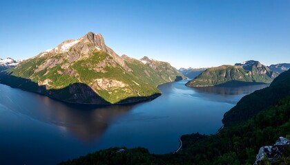 A serene fjord panorama showcasing towering mountains reflecting in the calm azure waters.