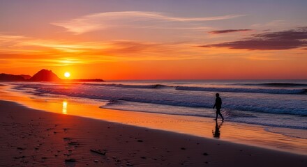 Silhouette of Person Walking on Beach at Sunset.