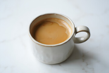 Fototapeta premium A Delicious Hot Beverage Steaming Gently in a Ceramic Mug on a Brightly Lit Marble Surface Creating a Cozy Morning Atmosphere