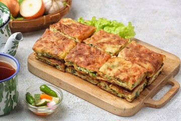 Martabak telor. Martabak is a dish commonly found in Saudi Arabia, Yemen, India, Bangladesh, Indonesia, Malaysia, Singapore, Southern Thailand and Brunei