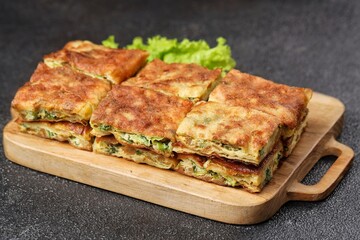 Martabak telor. Martabak is a dish commonly found in Saudi Arabia, Yemen, India, Bangladesh, Indonesia, Malaysia, Singapore, Southern Thailand and Brunei