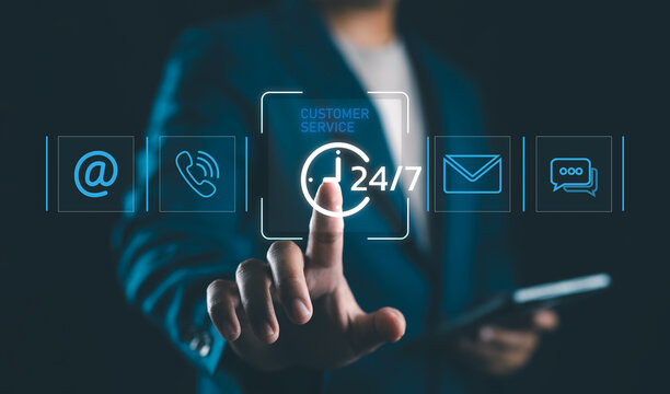 Customer Service Call Center, Contact US, Care Support Hotline, Hand touches glowing digital phone icon among various communication symbols, representing customer service and multiple contact methods.