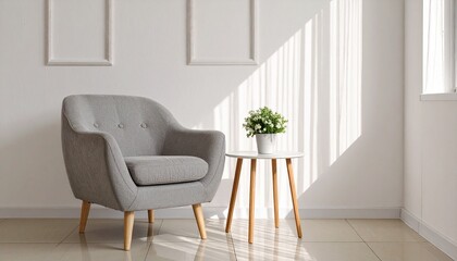 Fototapeta premium Minimalist living room interior with a gray armchair, side table, and blank frame mockup for wall art