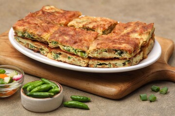 Martabak telor. Martabak is a dish commonly found in Saudi Arabia, Yemen, India, Bangladesh, Indonesia, Malaysia, Singapore, Southern Thailand and Brunei