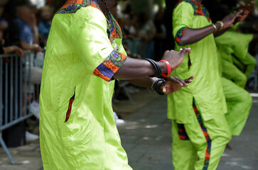 Dancers dancing and wearing one of the traditional folk costume from Dakar, Senegal