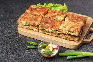 Martabak telor. Martabak is a dish commonly found in Saudi Arabia, Yemen, India, Bangladesh, Indonesia, Malaysia, Singapore, Southern Thailand and Brunei