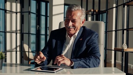 Elderly man engaging with digital tablet in sunlit modern workspace - Powered by Adobe