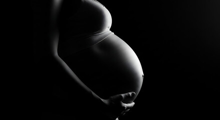 Elegant monochrome silhouette of an expecting woman, celebrating the beautiful journey of maternity and new life