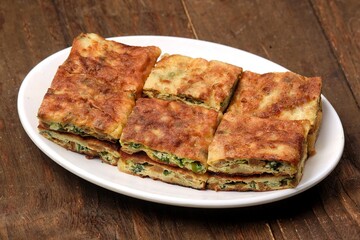 Martabak telor. Martabak is a dish commonly found in Saudi Arabia, Yemen, India, Bangladesh, Indonesia, Malaysia, Singapore, Southern Thailand and Brunei