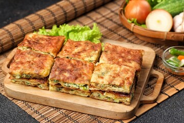 Martabak telor. Martabak is a dish commonly found in Saudi Arabia, Yemen, India, Bangladesh, Indonesia, Malaysia, Singapore, Southern Thailand and Brunei