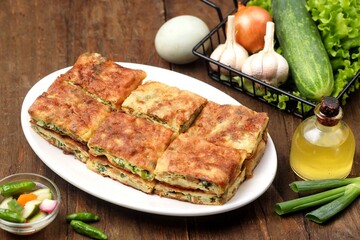 Martabak telor. Martabak is a dish commonly found in Saudi Arabia, Yemen, India, Bangladesh, Indonesia, Malaysia, Singapore, Southern Thailand and Brunei