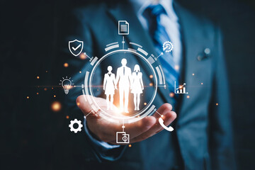 Businessman presents digital network of connected people and business technology icons for future innovation