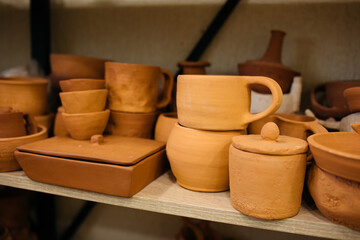 clay pottery on a shelf	