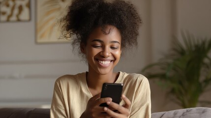happy african millennial woman holding smart phone watching social media video content smiling young black teen gen z girl using funny mobile app laughing playing game chatting on cell at home no log