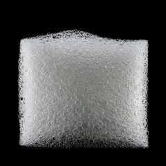 A close-up view of a rectangular cleaning sponge saturated with soapy bubbles. A macro shot of the sponge's texture, showing numerous air bubbles in a pattern against a pure black background.