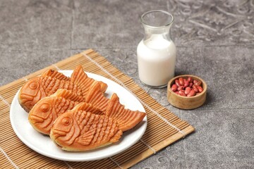 Bungeoppang Taiyaki is a popular Japanese fish-shaped cake filled with red bean jam, usually sold as a street food.