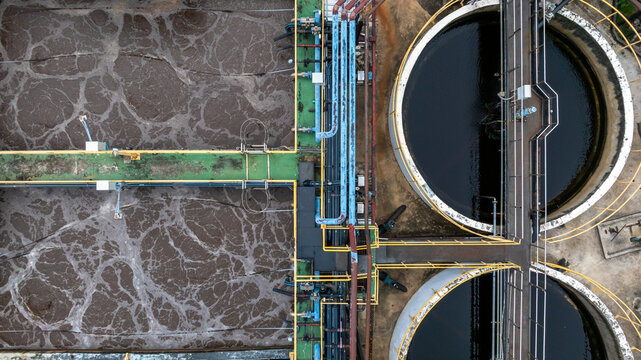 Aerial view blackwater treatment tank with waste water, Circle circular water clarifier cleaning water.