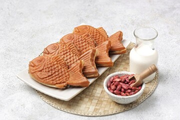 Bungeoppang Taiyaki is a popular Japanese fish-shaped cake filled with red bean jam, usually sold as a street food.