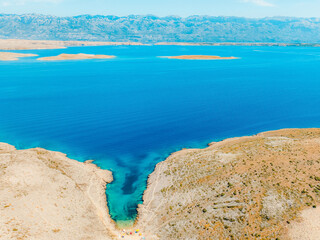 Vrsi near Zadar archipelago cove beach in stone desert scenery near Zecevo island, Dalmatia in...