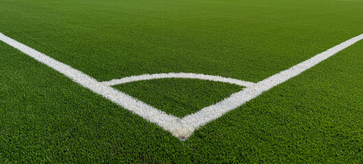 The football field corner with artificial green grass. Line  in corner area of soccer field. Photo...