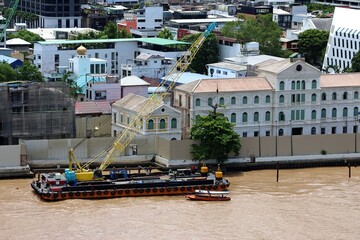 Tugboat and Barge with Crawler Crane on Chao Phraya River Bangkok
