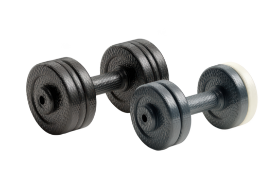 Black dumbbells, various sizes, against black background. Weights for strength training
