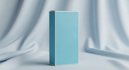 Light blue box on a white draped fabric background.