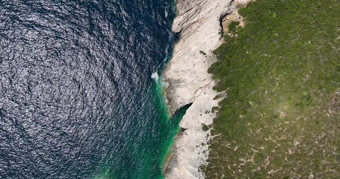 Top-down shot showcasing the rugged coastline and clear waters of Dugi Otok